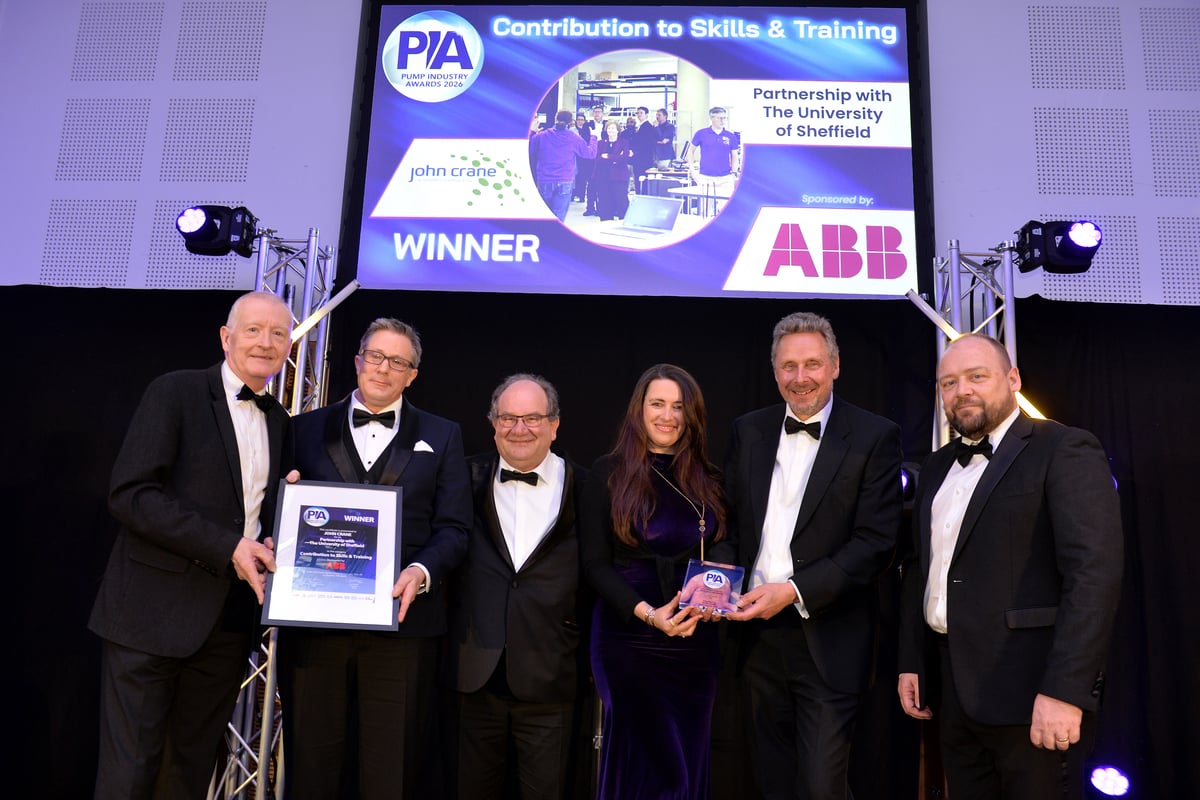 Representatives from John Crane receiven the PIA 2026 awards on stage.