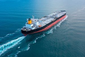 Oil tanker underway towards open sea. Crude oil tanker ship, a merchant ship specially designed for chemical products transportation. Aerial view. Black Sea