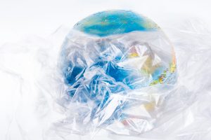 Planet Earth as seen from the sky wrapped in transparent plastic