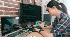 A woman sitting behind a computer