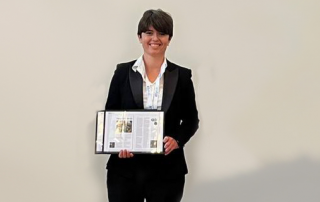 Francesca Torriani, Chair of the ESA’s Flange Gaskets Division, holding a plaque.