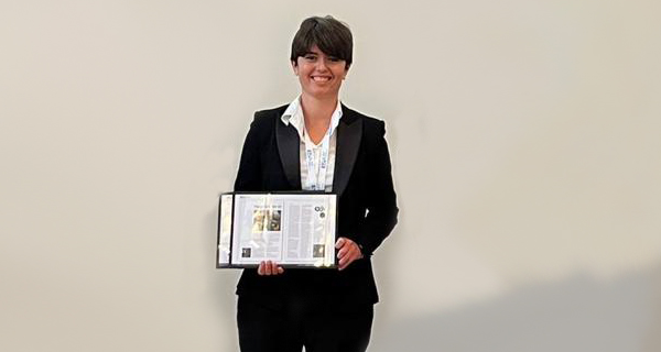 Francesca Torriani, Chair of the ESA’s Flange Gaskets Division, holding a plaque.