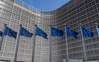 European flags in front of headquarters of European commission in Brussels in summer day