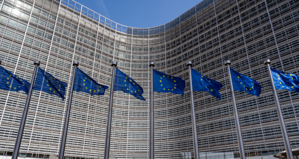 European flags in front of headquarters of European commission in Brussels in summer day