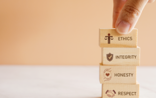 Hand holding wooden block with code of conduct concept, ethics, integrity, honesty, respect.